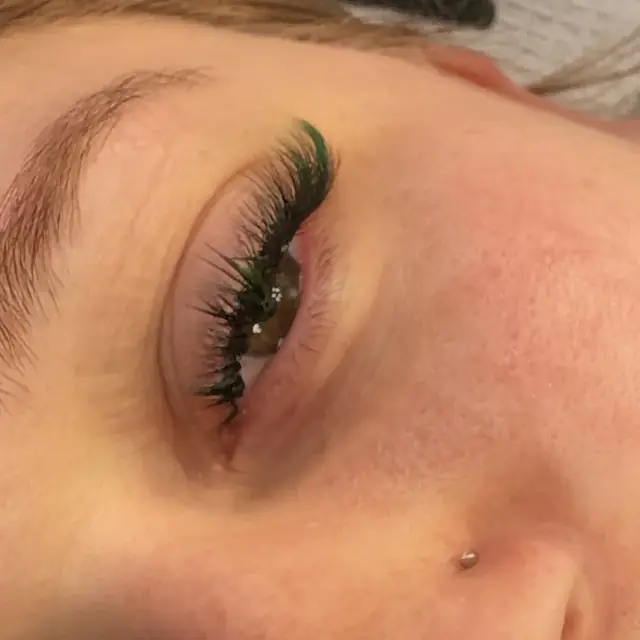 Green color lashes by Whiplash, LLC in Manitowoc, WI