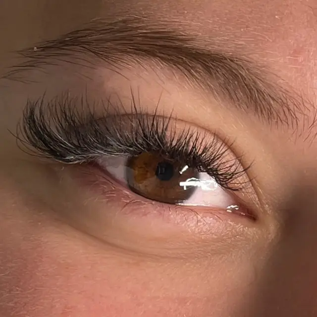Natural black lash extensions by Whiplash, LLC in Manitowoc, WI