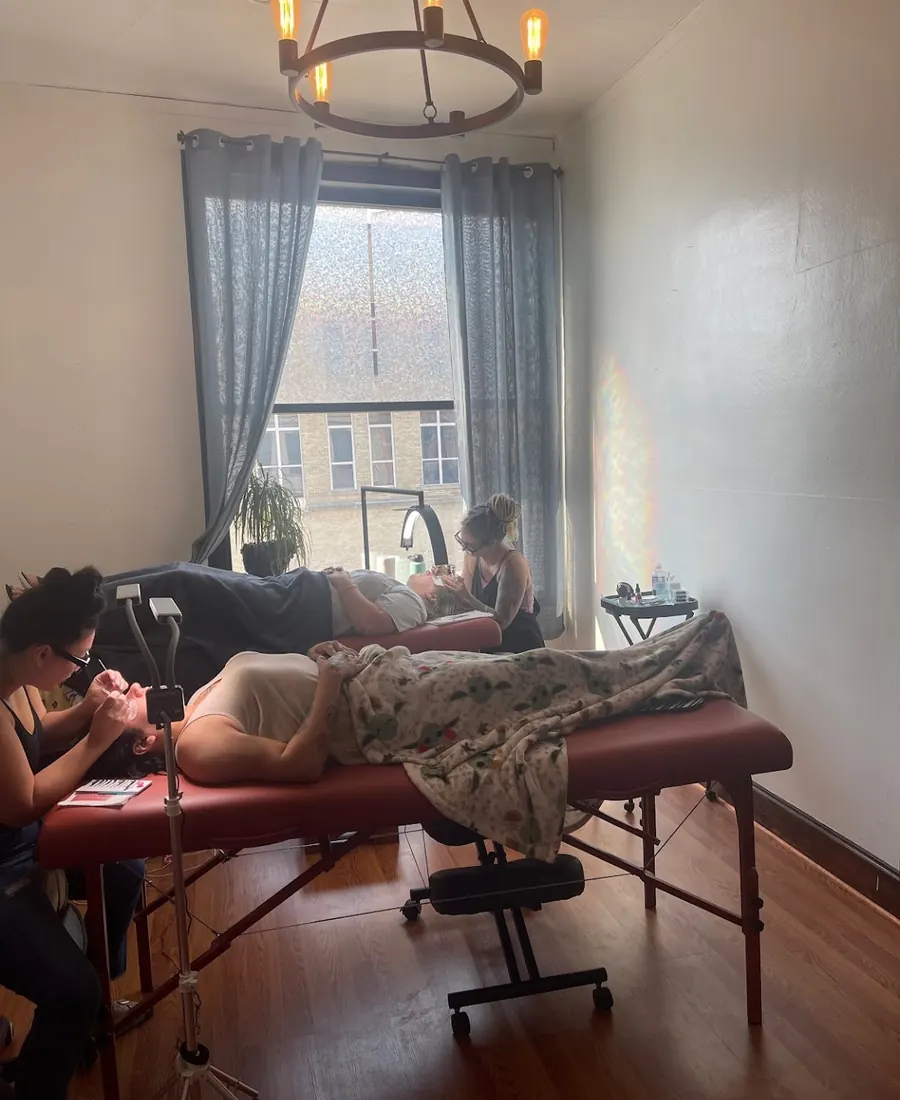 Two lash artists working in the Whiplash, LLC studio on N 8th St