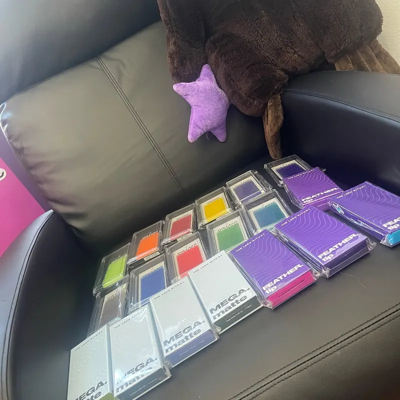 Trays of colored lash extensions in the Whiplash studio